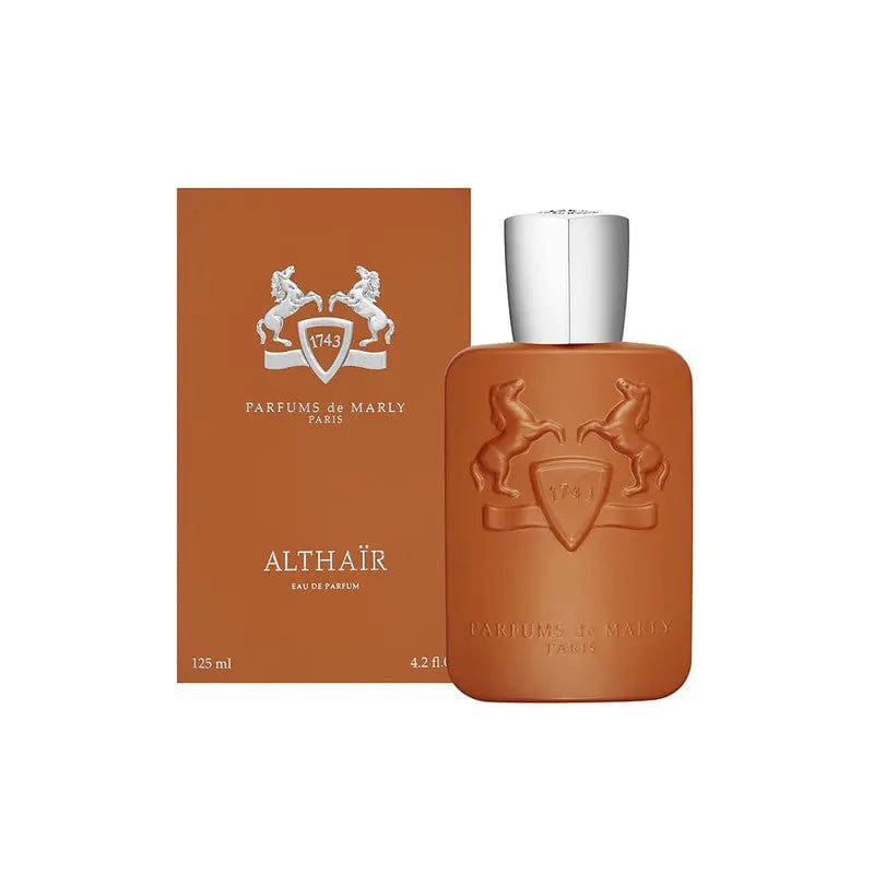 The Parfums De Marly Althaïr perfume bottle displayed next to its matching, beautifully designed box. The image highlights the complete product packaging, perfect for gifting, and emphasizes the brand's luxurious presentation.