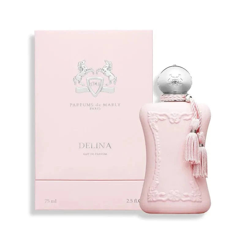 The Parfums De Marly Delina perfume bottle and its elegant pink box with silver accents. The image showcases the complete, luxurious presentation of the product.