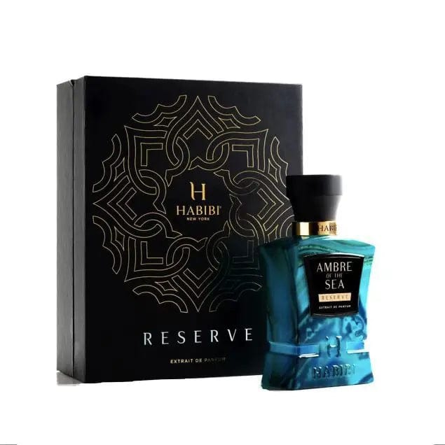 A professional product photo of the Habibi Ambre Of The Sea Reserve perfume bottle and its elegant gold and black box.