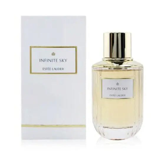 A professional product shot of the Estée Lauder Infinite Sky perfume bottle and its elegant white box with gold accents. The image showcases the complete, luxurious presentation of the product.