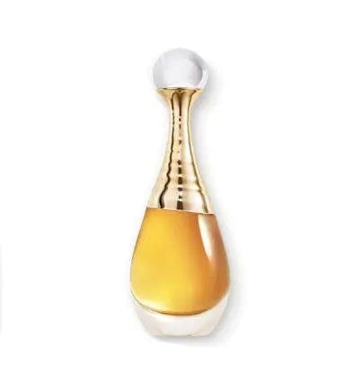 A professional close-up shot of the Dior J'adore l'Or perfume bottle, showcasing its shimmering golden liquid, the unique design of its neck, and the crystal-clear cap. The image emphasizes the refined craftsmanship of the bottle.