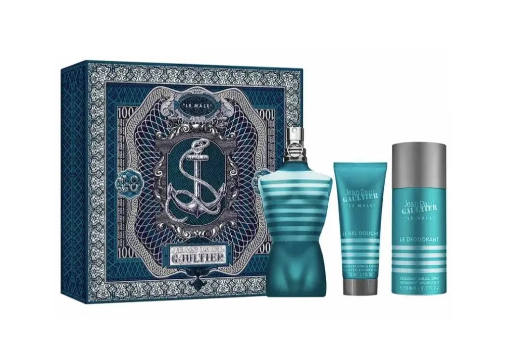 The Jean Paul Gaultier Le Male 3-piece gift set, displaying the Eau de Toilette, shower gel, and deodorant next to their ornate, dark blue nautical-themed box.