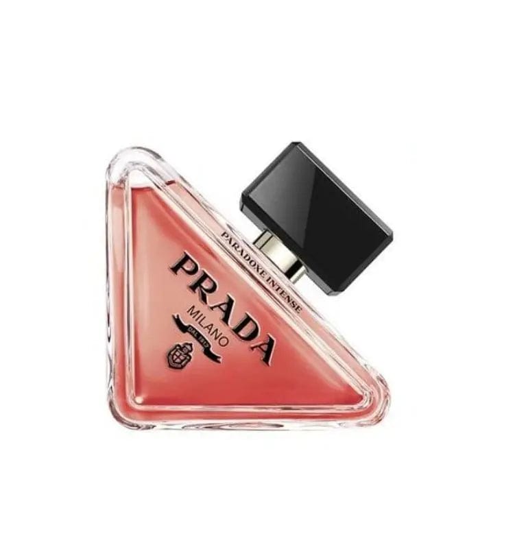 The iconic triangular bottle of Prada Paradoxe Intense 3.0 oz EDP, showing its deep coral liquid and black cap.