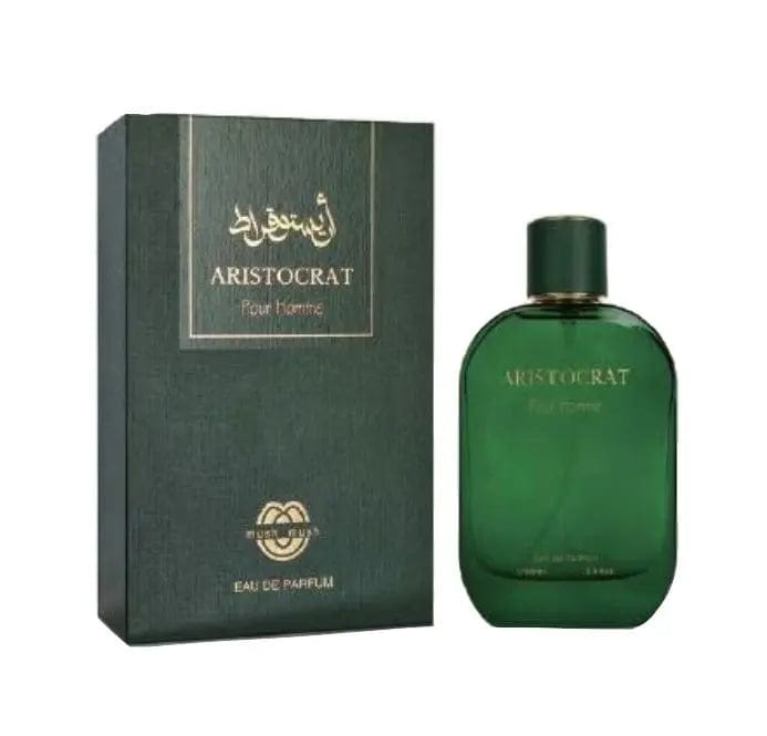 The Aristocrat Pour Homme by Mush Mush 3.4 oz EDP bottle, featuring a classic rounded green glass design, shown next to its matching textured dark green and gold presentation box.