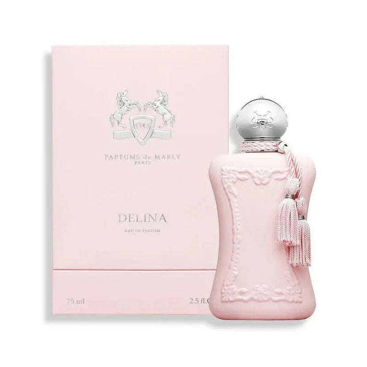 The Parfums De Marly Delina perfume bottle and its elegant pink box with silver accents. The image showcases the complete, luxurious presentation of the product.