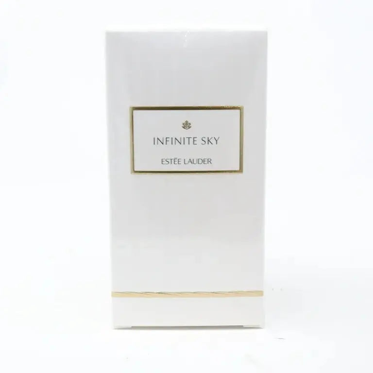 A close-up view of the Estée Lauder Infinite Sky perfume box, highlighting its minimalist design and the gold-bordered label.