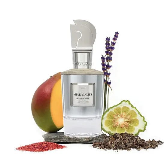 Mind Games Blockade Scent Notes: A creative and artistic product shot of the Blockade perfume bottle surrounded by the fragrance&