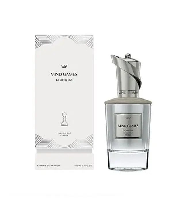 The Mind Games Queening perfume bottle and its luxurious white and silver box, both featuring a modern, geometric pattern and the Mind Games branding. 