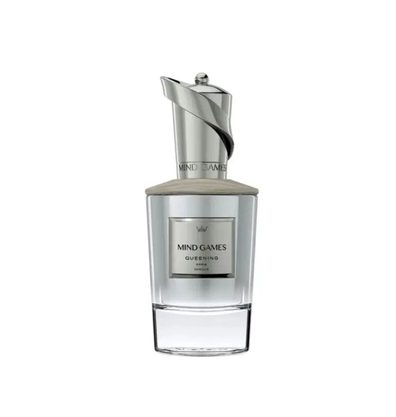 A close-up, front-facing view of the Mind Games Queening perfume bottle. The image highlights its crystal-clear glass, the elegant silver label, and the unique, swirling silver chess-piece cap.