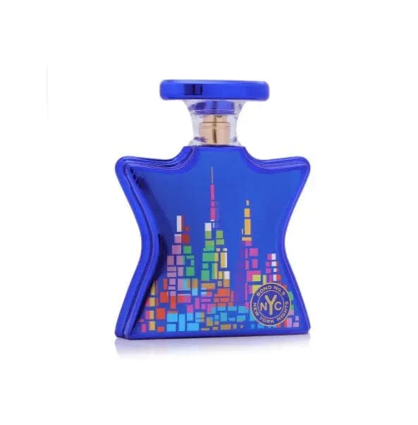 A clear, front-facing view of the iconic star-shaped Bond No. 9 New York Nights perfume bottle, featuring a colorful and detailed illustration of the city's skyline on a deep blue background.