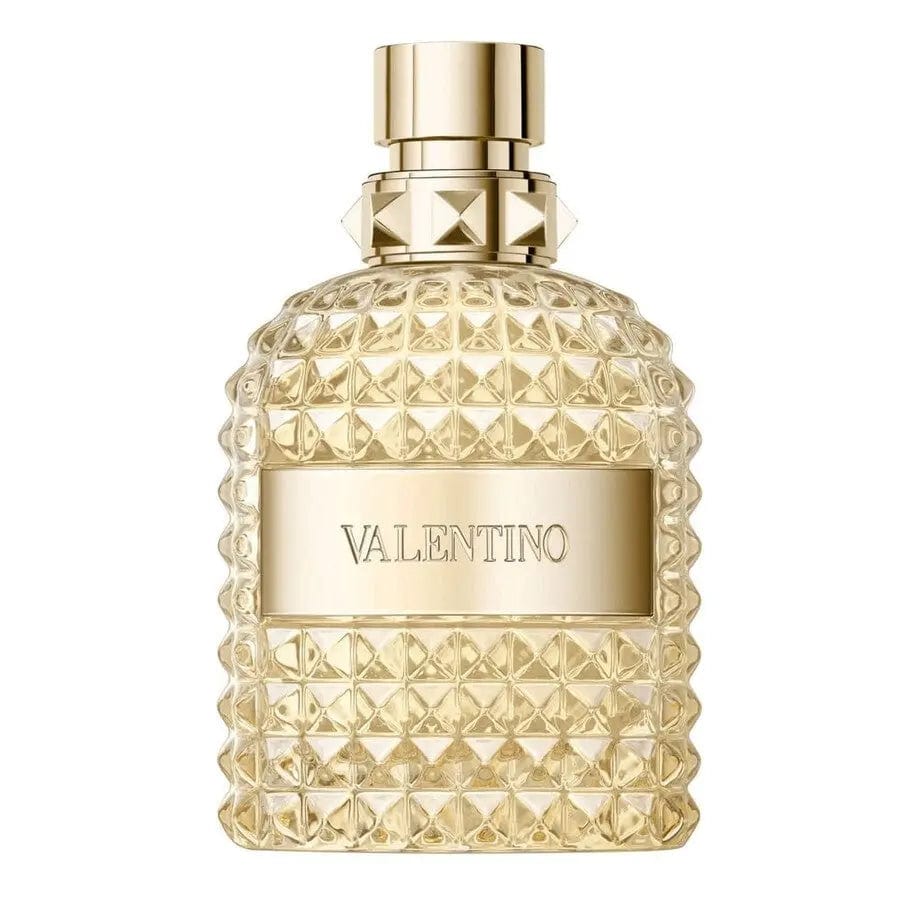 The Valentino Uomo Born in Roma The Gold 3.4 oz EDT bottle, showing its gold-studded glass design and matching gold cap.